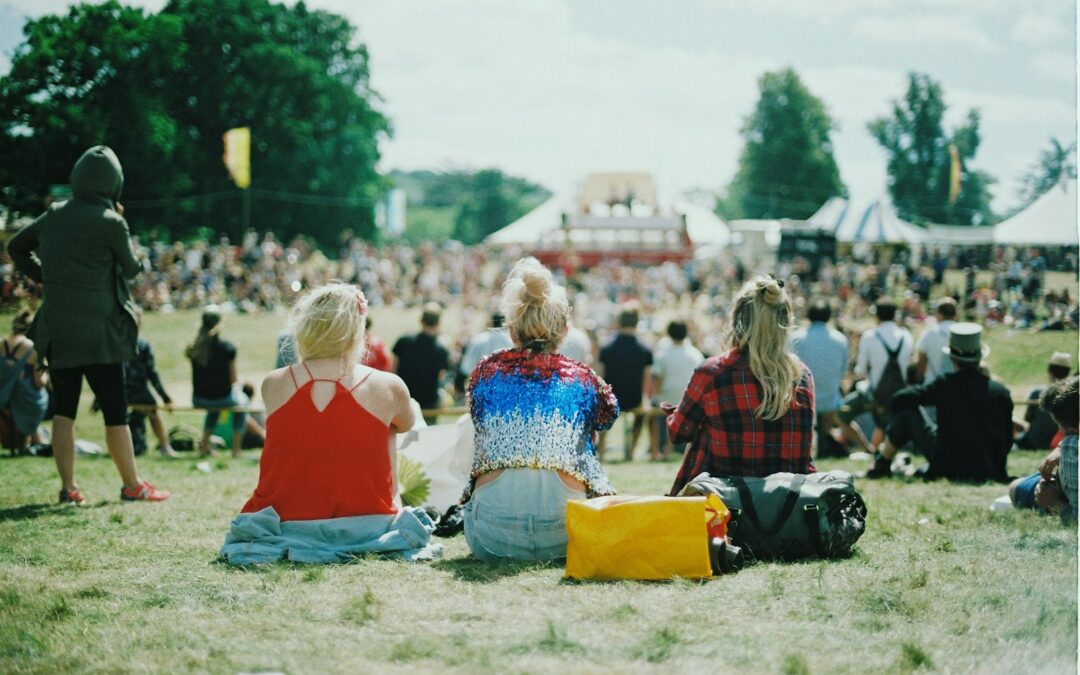 group of people on grass field under sunny day